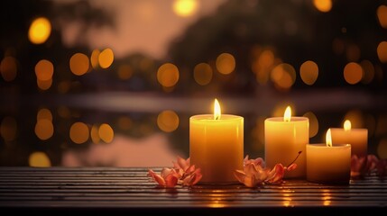 A group of romantic lit candles with petals placed on a wooden table against the background of a blurred pond