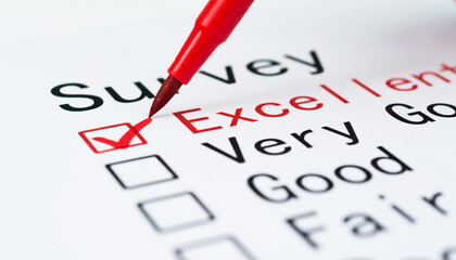 Pen checking the word very good in a survey