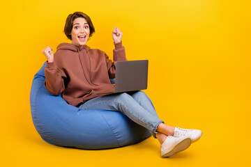 Full photo of young addicted player woman betting relax pouf fists astonished with laptop wear...
