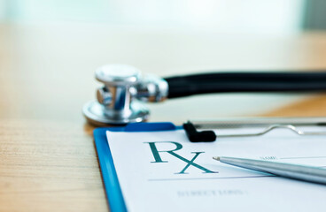 Closeup of stethoscope on rx prescription
