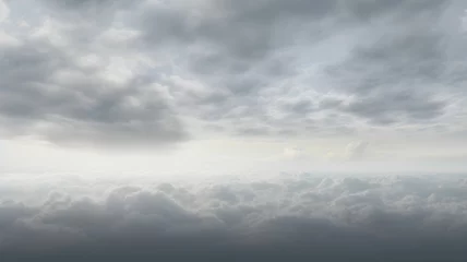 Fotobehang cloudy sky, grey sky with clouds, bad weather, rainy day, winter day during a storm, sky background with clouds, dark clouds, flying over the clouds, picture from plane © Ncorp
