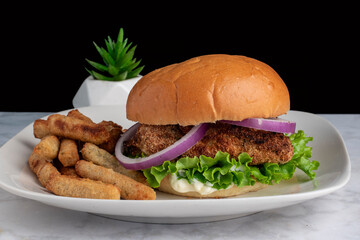 chicken breast  top with onions on a brioche bun