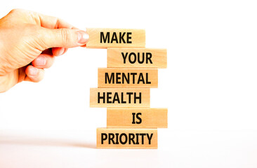 Mental health psychological symbol. Concept words Make your mental health a priority on wooden...