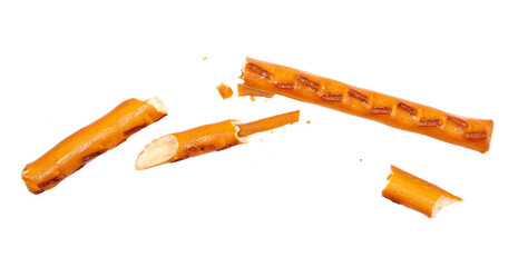 Broken salty cracker pretzel sticks in fly, stuffed with peanuts and crumbs isolated on white 