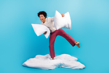 Full body photo of overjoyed carefree person have good mood dancing blankted hold cushion isolated...