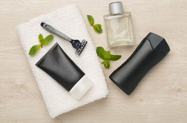 Set of men's shaving tools on wooden background, top view