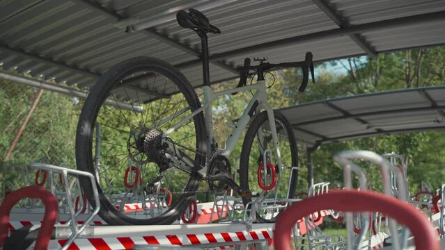 Bicycle infrastructure and modern multi-functional double decker parking lot with many slots in Germany. Modern two-level cycling parking in Europe. Bike parked on second level on dual floor park. 