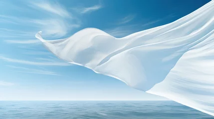 Zelfklevend Fotobehang light white fabric flutters in the wind against the blue sky.background.  © Margo_Alexa