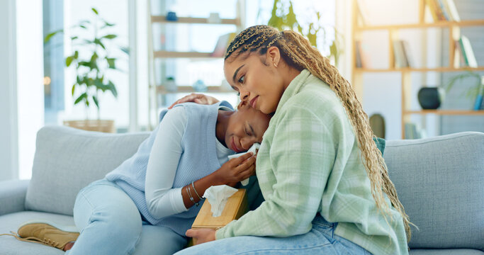Depression, empathy and support with black woman friends on a sofa in the living room of a home together. Sad, mental health and a young person crying into a tissue during loss, pain or grief