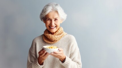 Happy senior woman enjoying nutritious breakfast bowl.