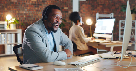 African man, call center and happy by computer, smile and excited for tech support, contact us or email. Consultant, crm or agent in night, telemarketing or customer service with smile in workplace - obrazy, fototapety, plakaty