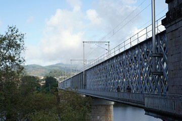A bridge with a massive iron structure.