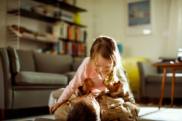 Young father embracing his daughter after coming back from the army at home