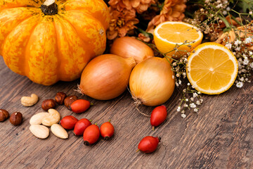 Autumn vegetables, nuts and rose hips. Healthy food. Vegetable diet