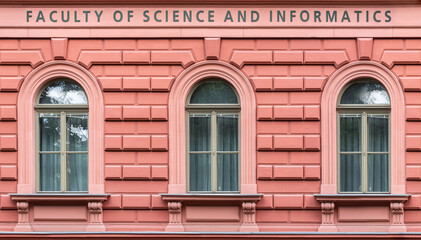 Three arched windows on a pink wall background. From the Windows of the world series. - obrazy, fototapety, plakaty