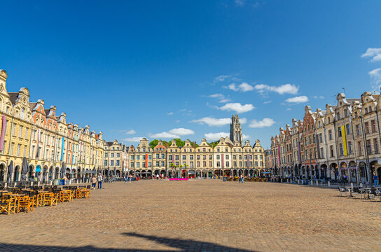 Arras cityscape with Flemish-Baroque-style townhouses buildings on La Petite market Place des Heros Heroes Square in historical city center, blue sky in summer day, Hauts-de-France Region, France
