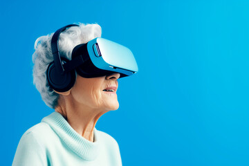 Senior woman using virtual reality headset on blue background. VR, future, gadgets, technology, education online, studying, video game concept. AI generated