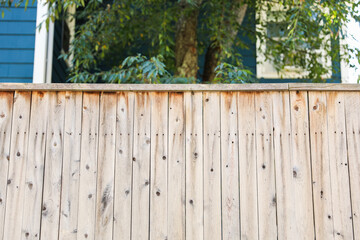 wooden fence basks in warm spring sunlight, evoking feelings of renewal, nostalgia, and the passage of time in a serene countryside setting