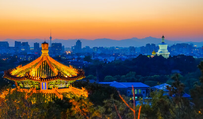 View of Beijing form a hill with beautiful Chinese temple and tower at sunset. - 657835761