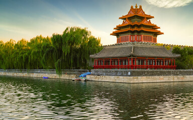View of the Forbidden City with the reflection on the moat at sunset in Beijing, China. - 657836536