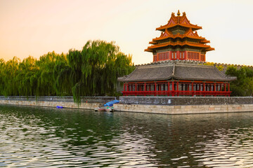 View of the Forbidden City with the reflection on the moat at sunset in Beijing, China. - 657836561