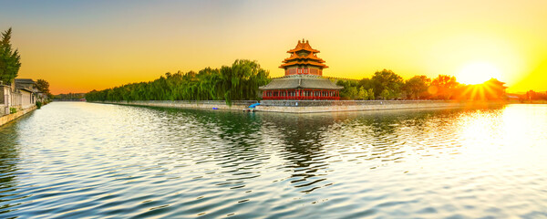 View of the Forbidden City with the reflection on the moat at sunset in Beijing, China. - 657836785