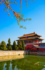 View of the Forbidden City with the reflection on the moat on a sunny day in Beijing, China. - 657836901