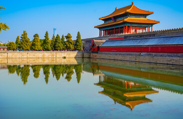 View of the Forbidden City with the reflection on the moat on a sunny day in Beijing, China. - 657836971