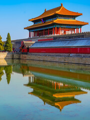 View of the Forbidden City with the reflection on the moat on a sunny day in Beijing, China. - 657836975