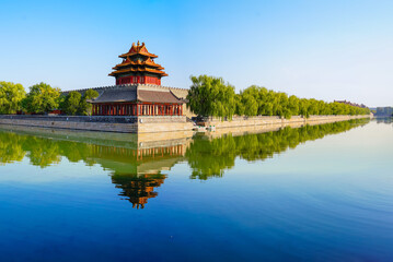 View of the Forbidden City with the reflection on the moat on a sunny day in Beijing, China. - 657837302