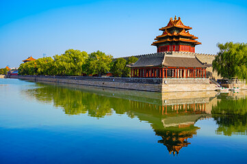 View of the Forbidden City with the reflection on the moat on a sunny day in Beijing, China. - 657837397