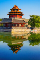 View of the Forbidden City with the reflection on the moat on a sunny day in Beijing, China. - 657837557
