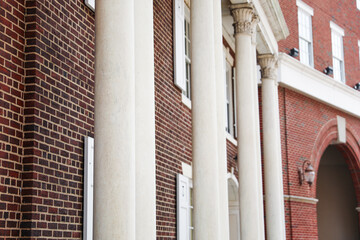 Greek columns, bathed in golden sunlight, evoke timeless grandeur and architectural mastery