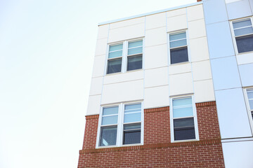 cityscape with sleek, towering skyscrapers in the golden hour light, representing urban growth, corporate success, and modern real estate development