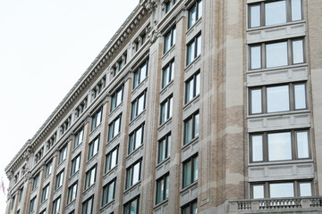 cityscape with a modern brick building, representing growth, commerce, and urban development