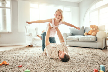 Flying, portrait and a child with father on the floor for playing, bonding and fantasy in a house....