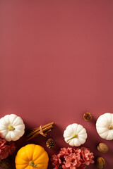 Obraz premium Happy Thanksgiving day poster design. Autumn frame of pumpkins, flowers, fall decor on brown background. Flat lay, top view, copy space.