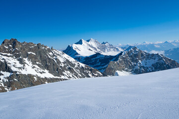 Saas-Fee, Switzerland - June 16th 2023: Panoramic view during a early-morning glacier descent 