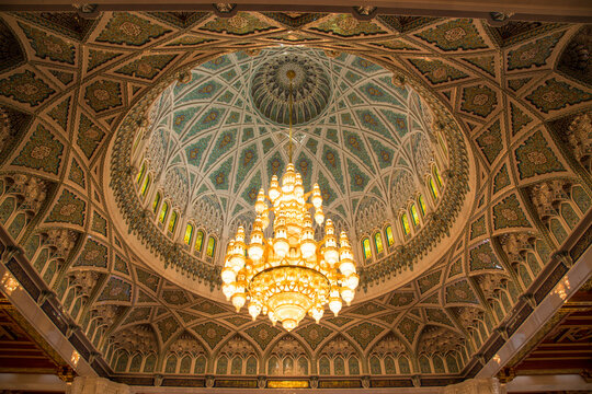 Chandelier above the praying hall inside the Sultan Qaboos Grand Mosque, viewed from directly below; Muscat, Oman