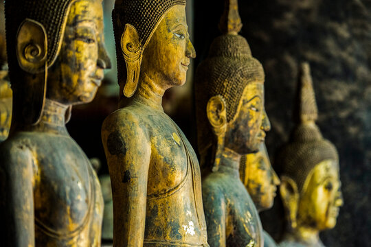 Row of standing Buddha images at Wat Visoun, commonly known as That Makmo; Luang Prabang, Laos