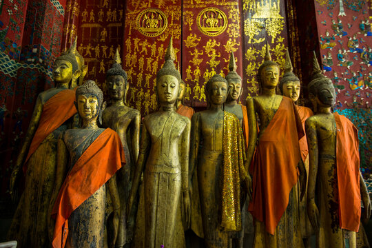 Bronze statues inside Wat Xieng Thong Monastery; Luang Prabang, Laos