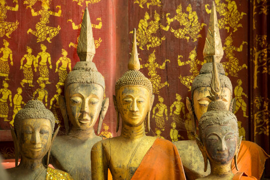 Bronze statues inside Wat Xieng Thong Monastery; Luang Prabang, Laos