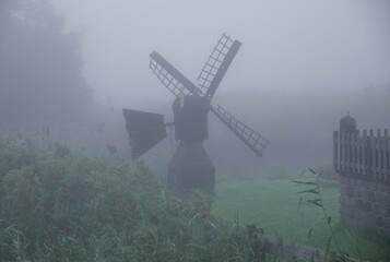 windmill in the morning fog