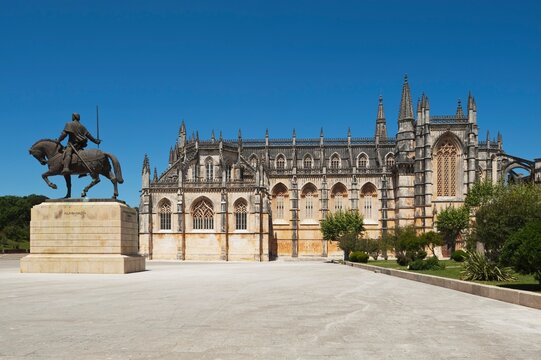 14Th Century Monastery Of Santa Maria Of Victoria, Better Known As Batalha (Battle Abbey) With Monument To Nvno Alvares Pereira (1360 - 1431) In The Foreground; Batalha, Estremadura And Ribatejo, Port