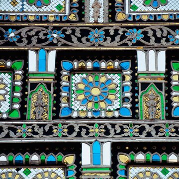 An Ornate Mosaic Of Blue, Yellow, White And Green Stone In Chedi Luang Temple; Chiang Mai, Thailand