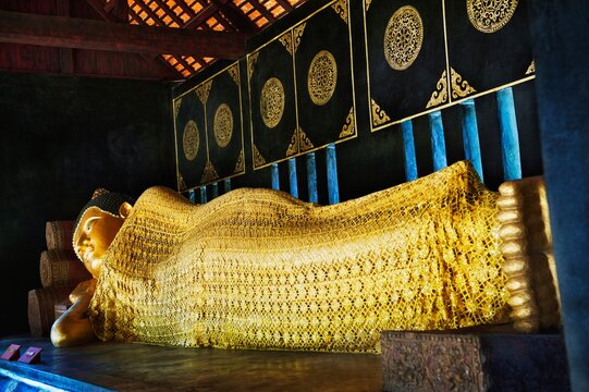 A Gold Statue Of A Reclining Buddha In Chedi Luang Temple; Chiang Mai, Thailand