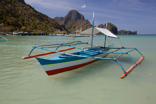 Bangka Boats Sit In The Picturesque And Scenic Bay; El Nido, Bacuit Archipelago, Palawan, Philippines