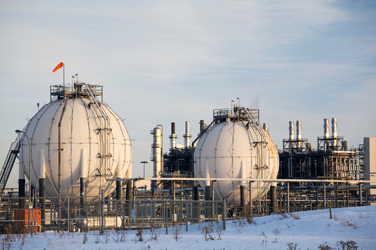 Spherical Oil Tanks And Refinery In Winter At Sunset; Fort Saskatchewan, Alberta, Canada