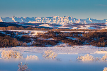 Bow River Valley in fog with the Rocky Mountains in the background, Calgary, Alberta - obrazy, fototapety, plakaty