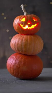 Halloween pumpkin piramid with glowing eyes 